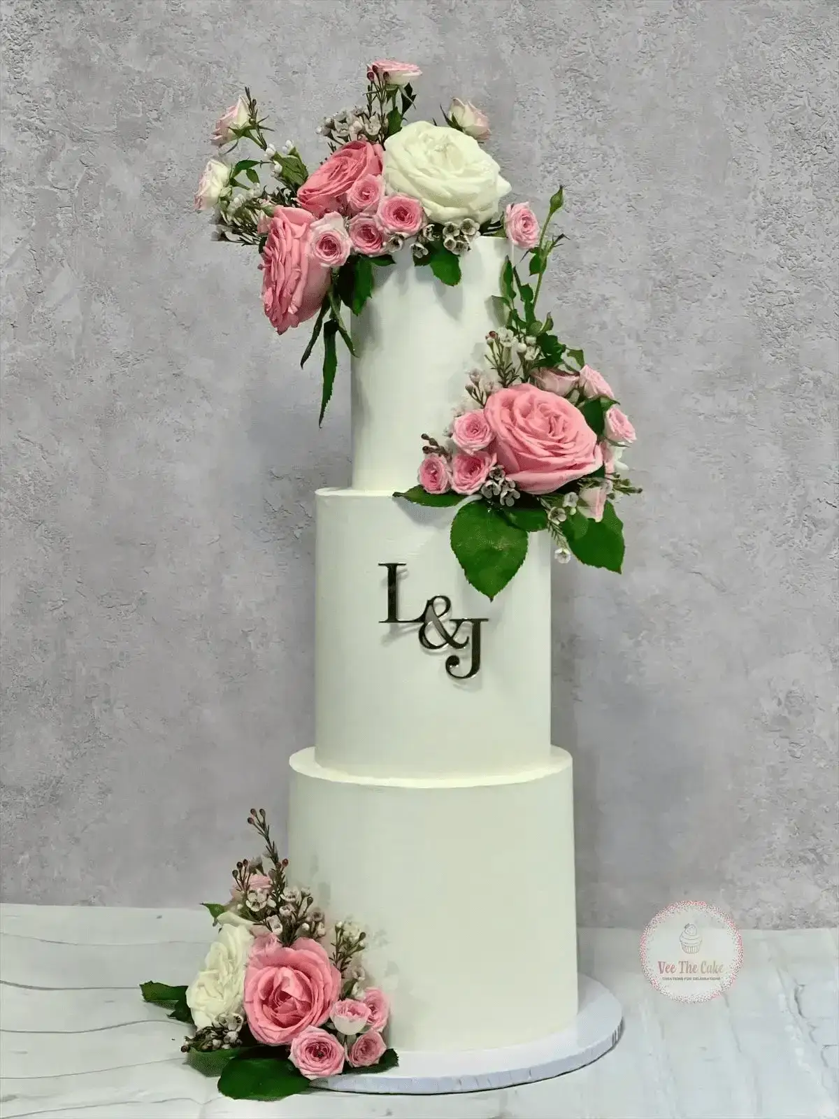 Classic white wedding cake with intricate piping details
