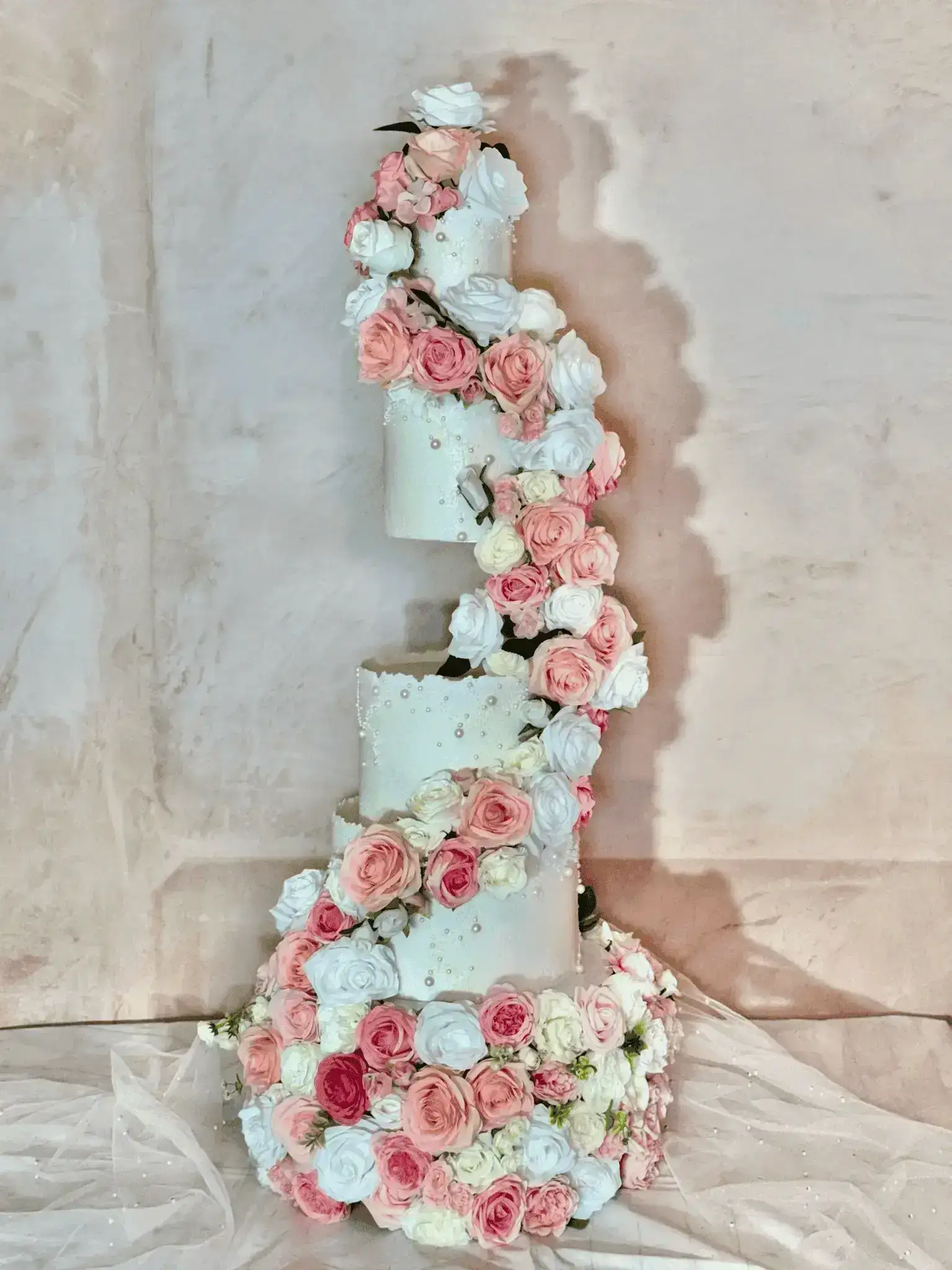 Elegant tiered wedding cake with sugar flowers in Nottingham